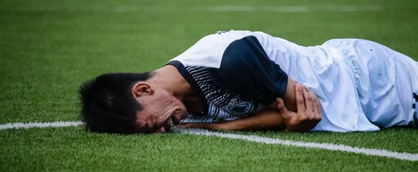 man-crying-on-field-1277396